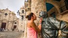 woman kissing statue cuba